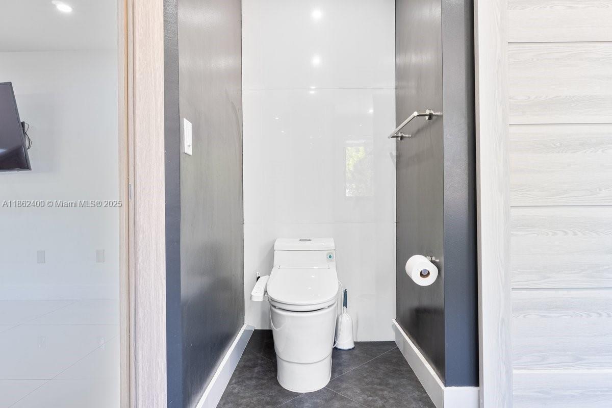 9035 Southwest 156th Court Miami, FL 33196 - Photo 17 of 33 a bathroom with a toilet and a sink