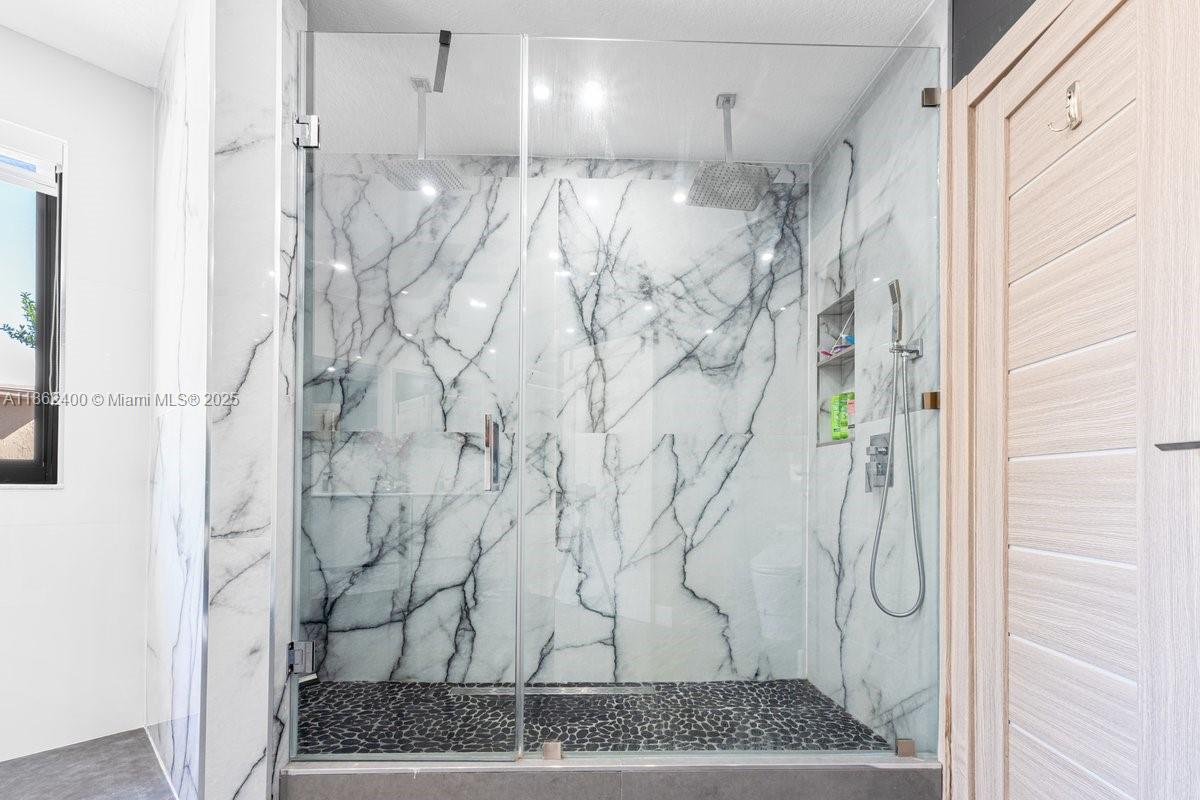 9035 Southwest 156th Court Miami, FL 33196 - Photo 18 of 33 a bathroom with a shower