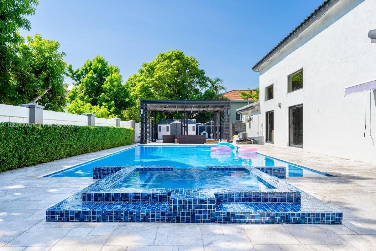 9035 Southwest 156th Court Miami, FL 33196 - Photo 28 of 33 a view of a house with backyard porch and sitting area