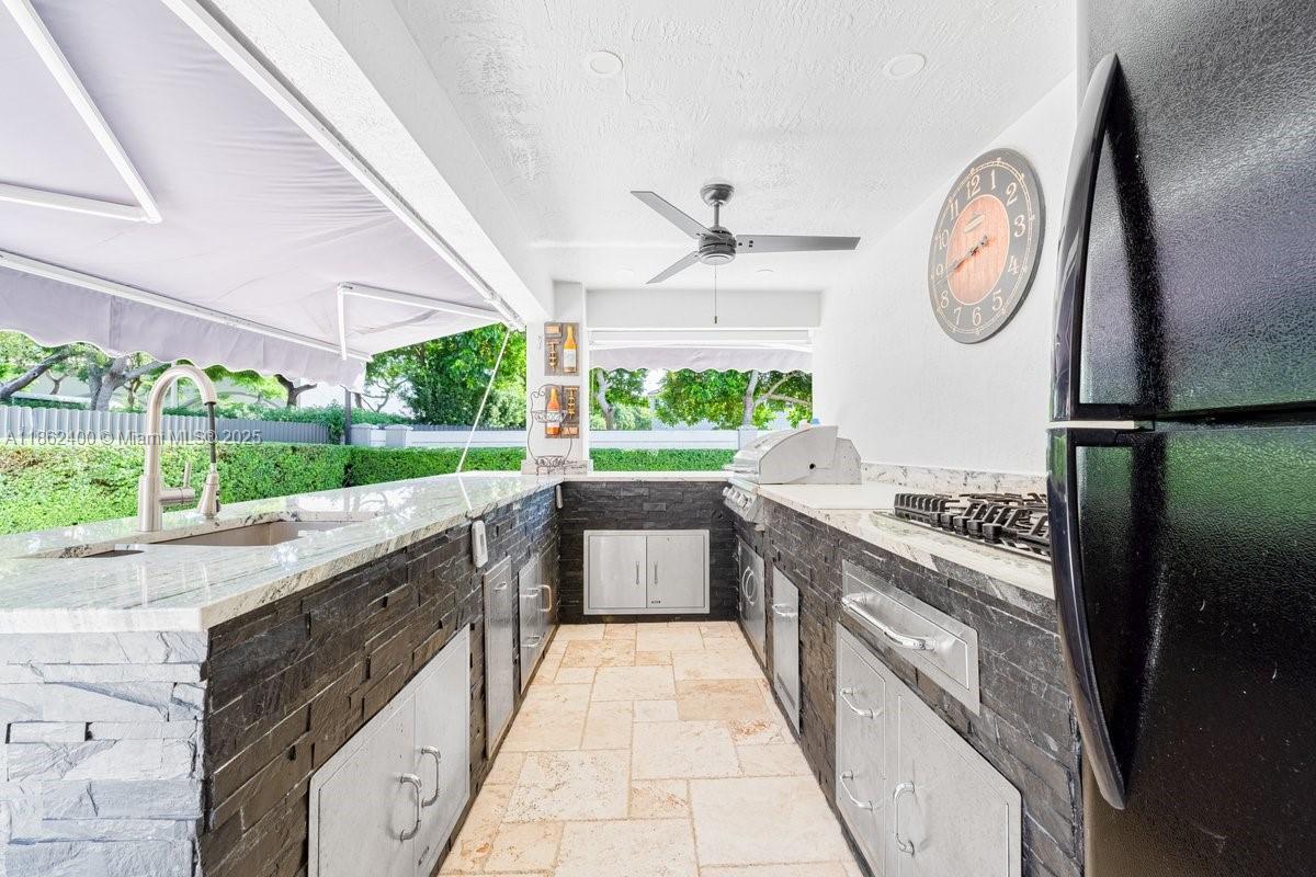 9035 Southwest 156th Court Miami, FL 33196 - Photo 30 of 33 a large kitchen with a stove and a large window