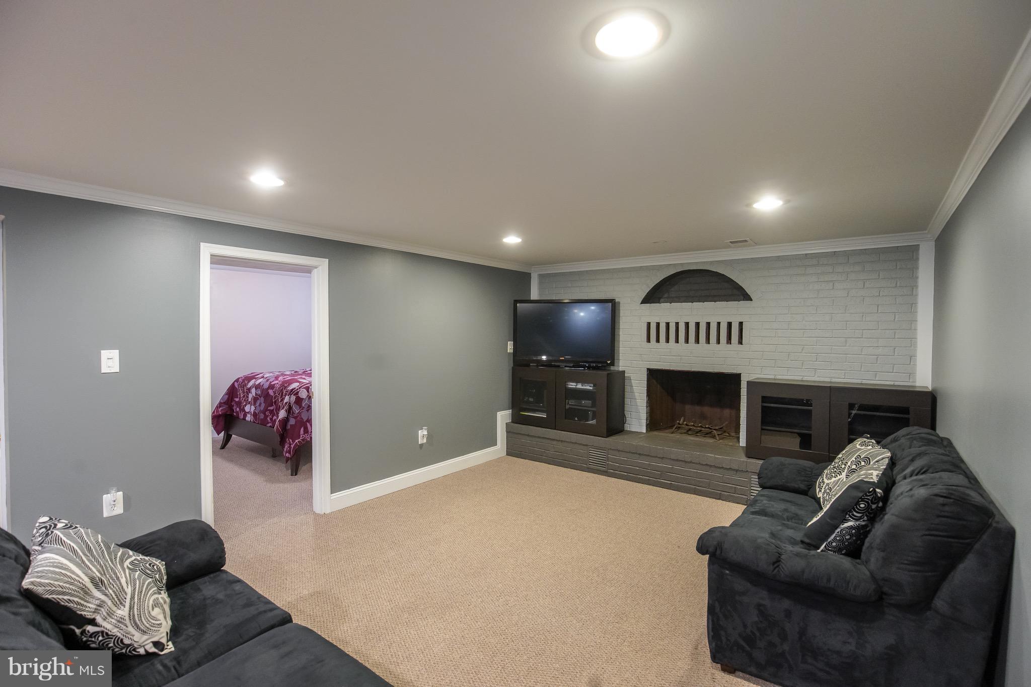 6918 Elbrook Road Hyattsville, MD 20784 - Photo 19 of 30 Working, wood-burning fireplace in basement