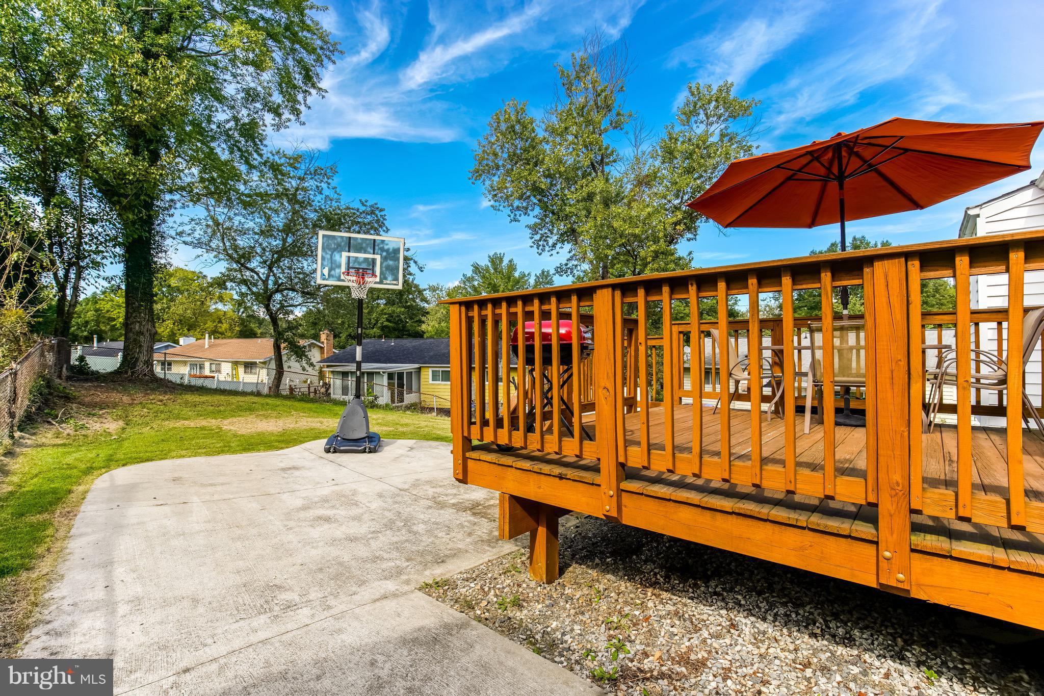 6918 Elbrook Road Hyattsville, MD 20784 - Photo 27 of 30 Large deck, patio, and huge yard for entertaining!