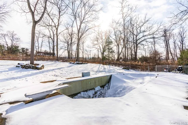 a view of a house with snow on the road
