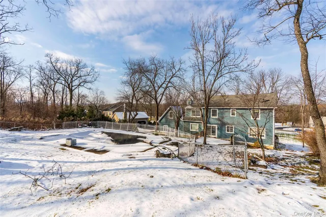 a view of a fire pit with snow on the road