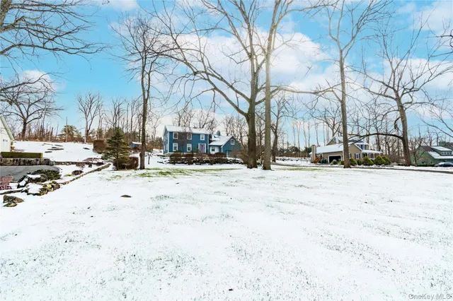 a view of road with snow on the roadside