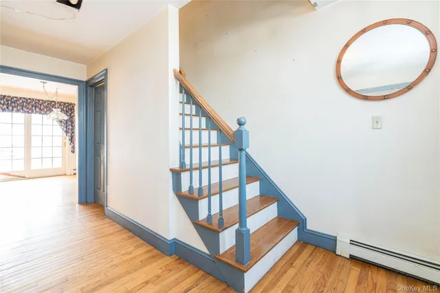 a view of an entryway with wooden floor