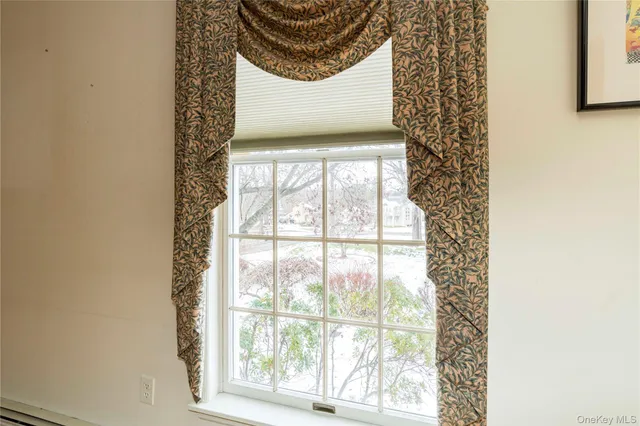 a view of terrace with wooden fence and trees