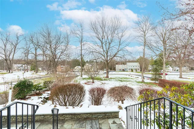 a view of swimming pool with seating space
