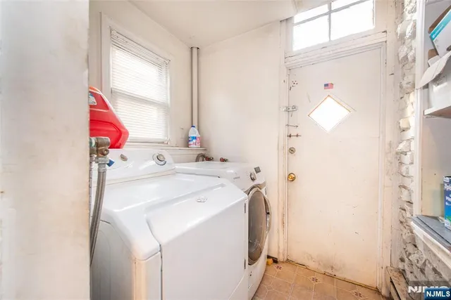 a utility room with dryer and washer