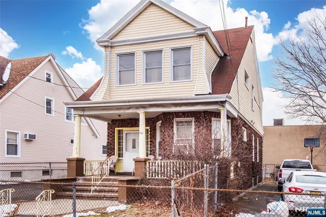a front view of a house with a porch