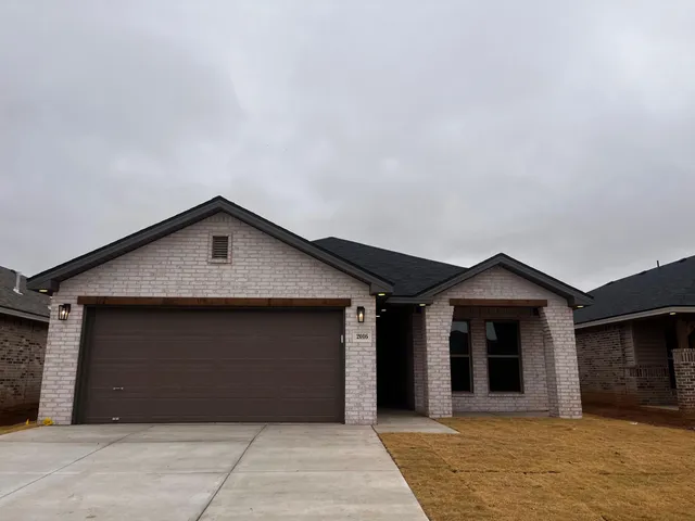 a front view of a house with a garage
