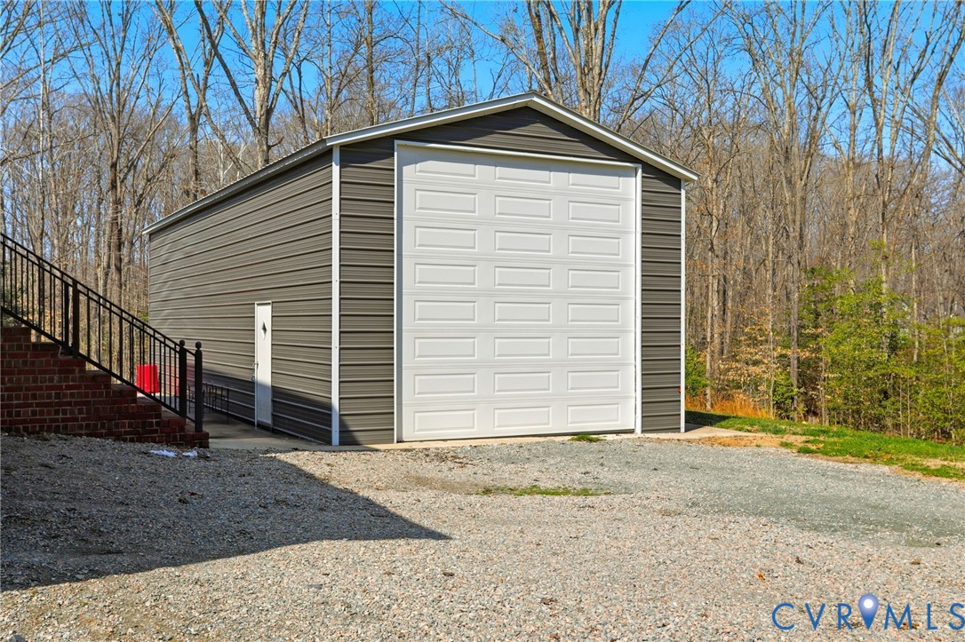 1738 Page Road Powhatan, VA 23139 - Photo 42 of 57 50' x 20' garage/workshop with 14' x 14' door.