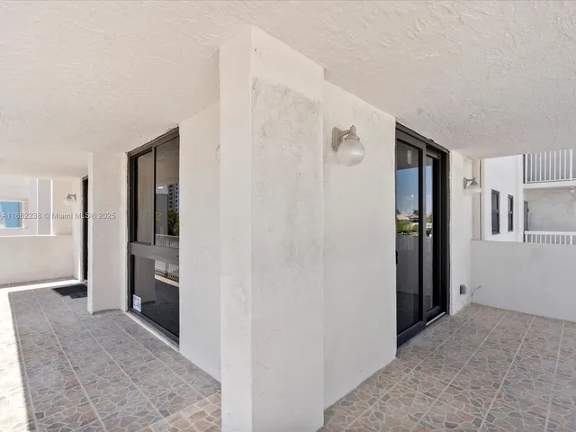 a view of hallway with livingroom and stairs