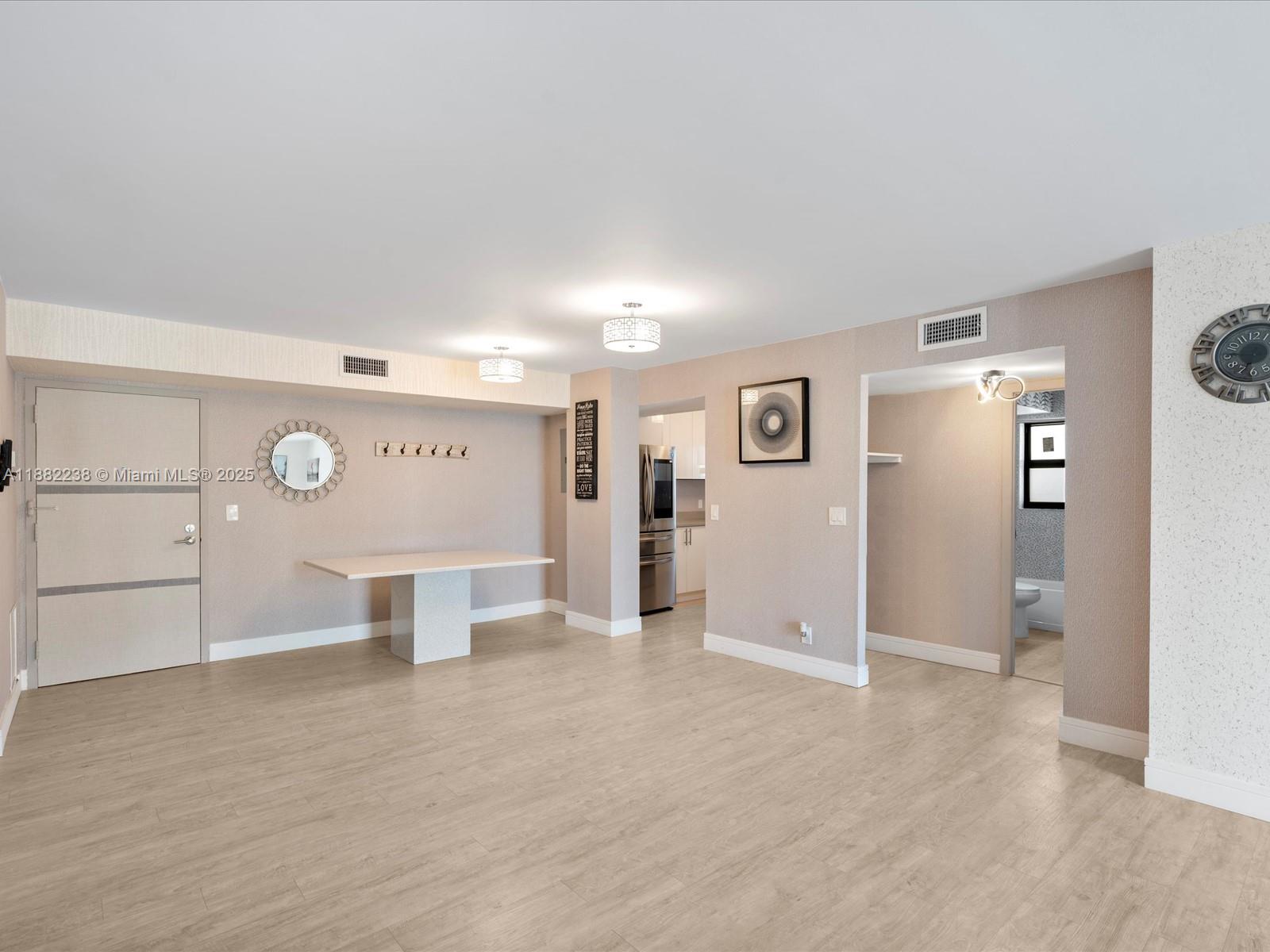 1500 South Ocean Drive, Unit 3G Hollywood, FL 33019 - Photo 9 of 37 a view of a kitchen with a refrigerator and a sink