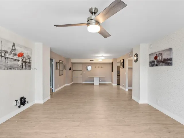 a view of livingroom with hardwood floor and a ceiling fan