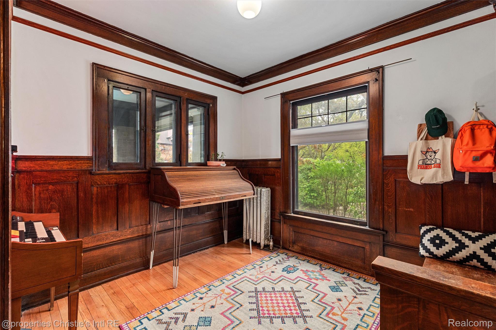36 Longfellow Street Detroit, MI 48202 - Photo 30 of 81 Office area with a wainscoted wall, crown molding, light wood-type flooring, radiator heating unit, and wood walls