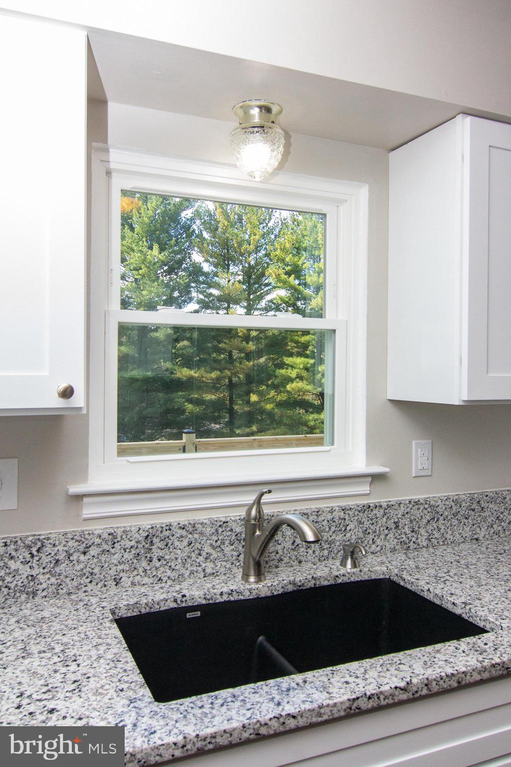 1526 Manchester Road Westminster, MD 21157 - Photo 11 of 41 a bathroom with a granite countertop sink and bathtub