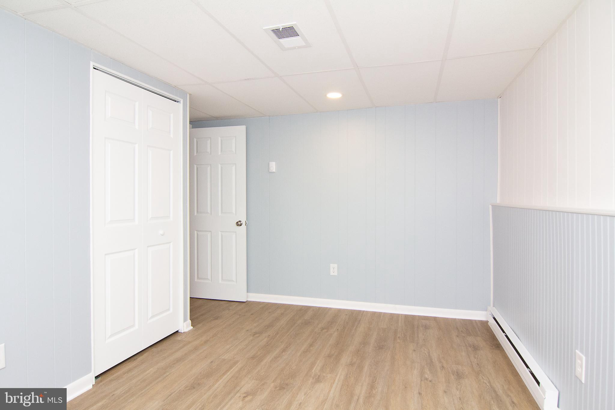 1526 Manchester Road Westminster, MD 21157 - Photo 29 of 41 an empty room with wooden floor