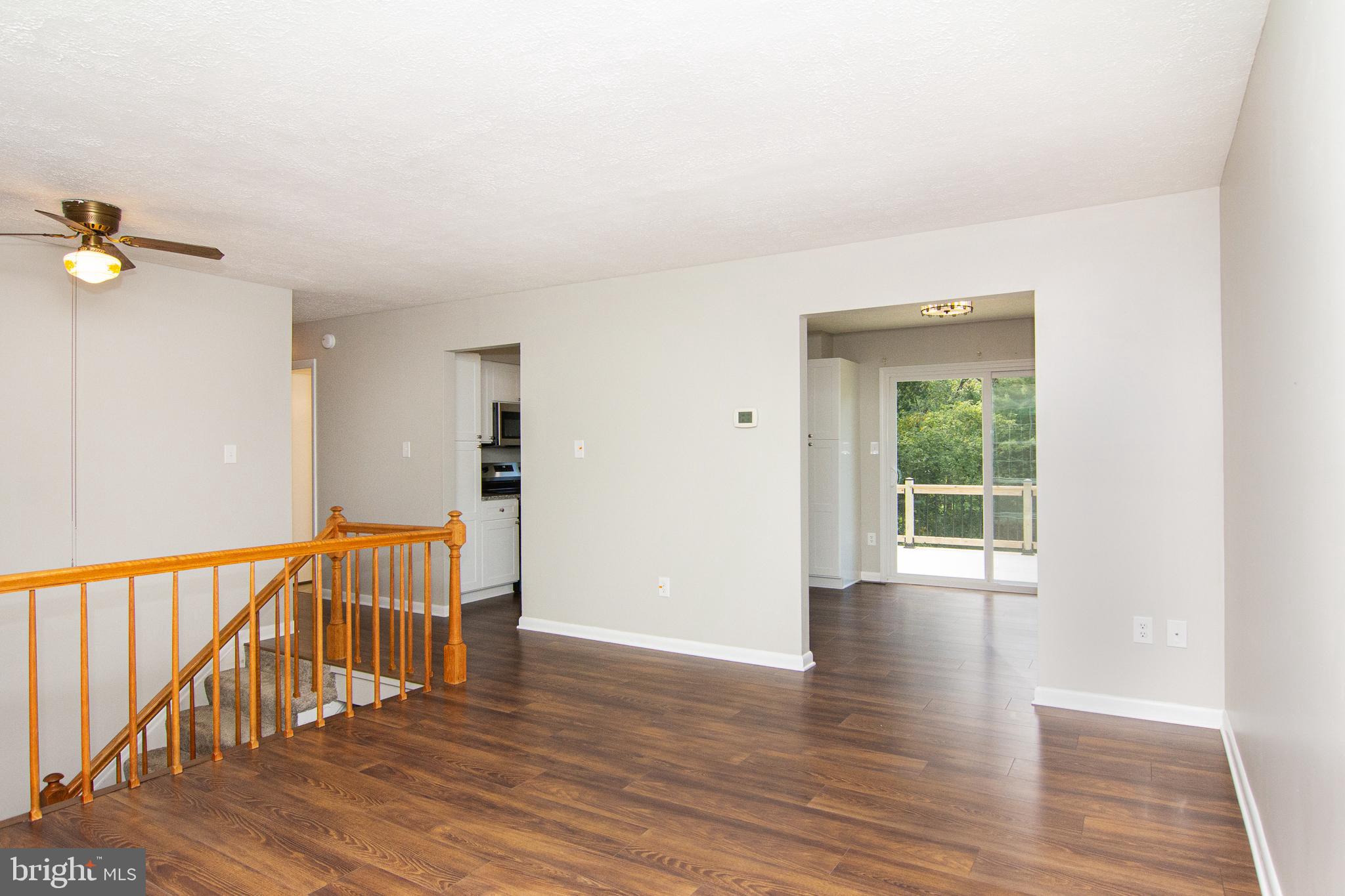 1526 Manchester Road Westminster, MD 21157 - Photo 5 of 41 wooden floor in an empty room with a window
