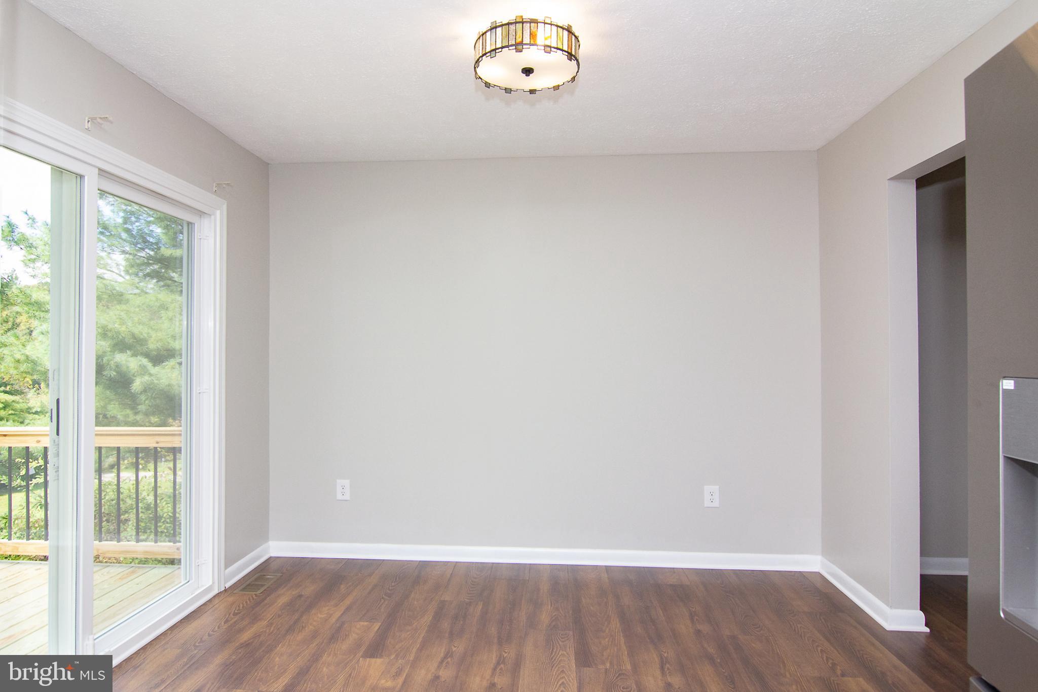 1526 Manchester Road Westminster, MD 21157 - Photo 6 of 41 a view of an empty room with a window