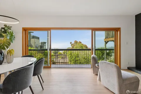 a view of a dining room with furniture window and outside view