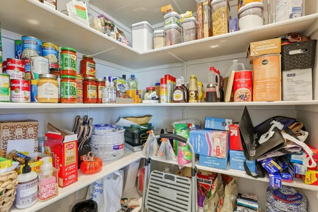 a store room with lots of clutter and storage
