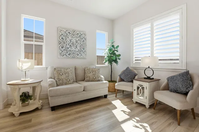 a living room with furniture and a window