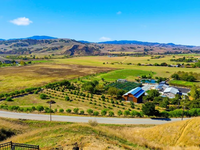 a view of swimming pool with a table and chairs