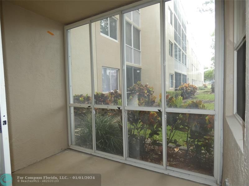 9525 Weldon Circle, Unit H110 Tamarac, FL 33321 - Photo 16 of 20 a view of a bathroom from a window
