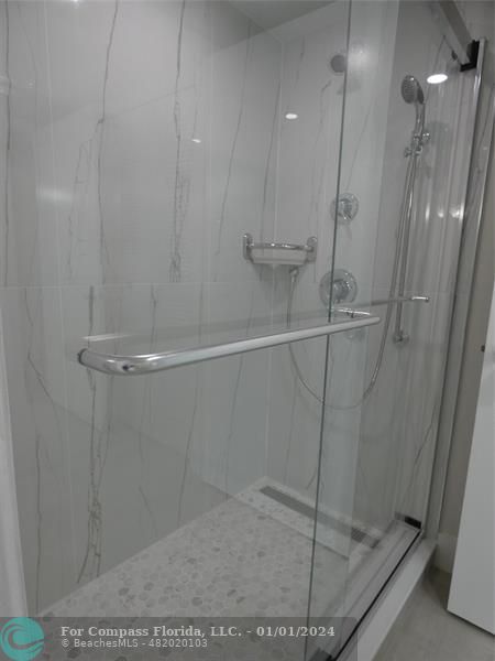 9525 Weldon Circle, Unit H110 Tamarac, FL 33321 - Photo 6 of 20 a bathroom with a shower