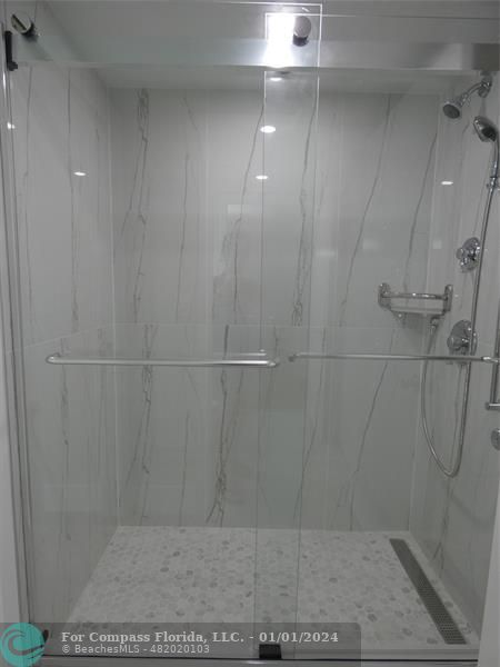 9525 Weldon Circle, Unit H110 Tamarac, FL 33321 - Photo 7 of 20 a bathroom with a shower