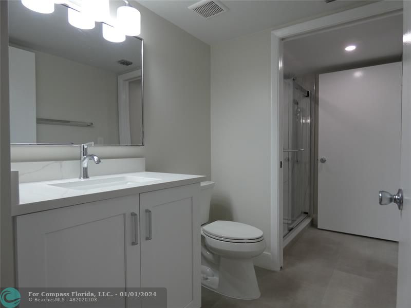 9525 Weldon Circle, Unit H110 Tamarac, FL 33321 - Photo 8 of 20 a bathroom with a sink a toilet and shower