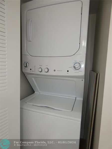 9525 Weldon Circle, Unit H110 Tamarac, FL 33321 - Photo 9 of 20 a close up view of washer and dryer