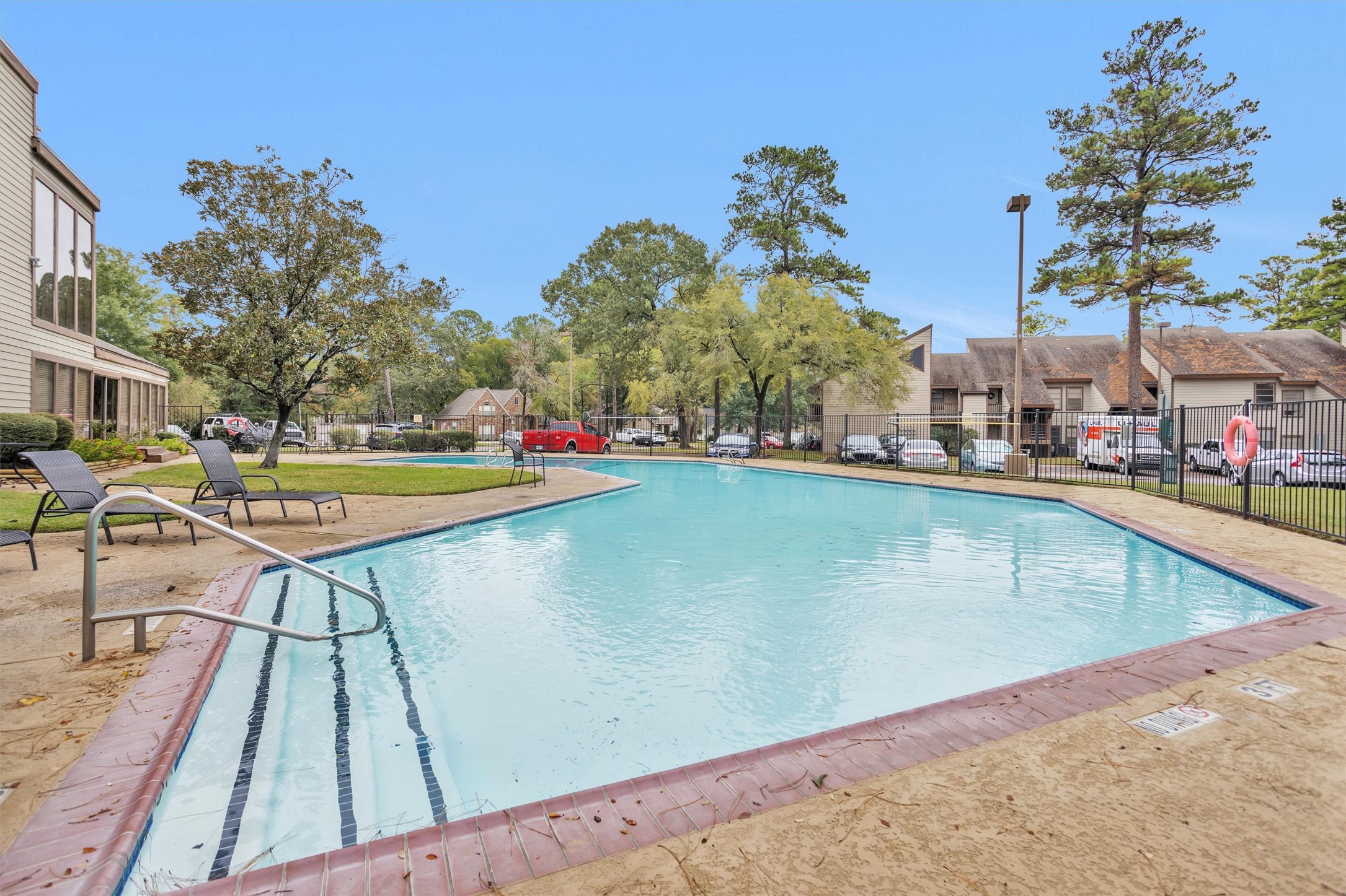 12900 Walden Road, Unit 513 Montgomery, TX 77356 - Photo 19 of 20 a view of a swimming pool with an outdoor seating