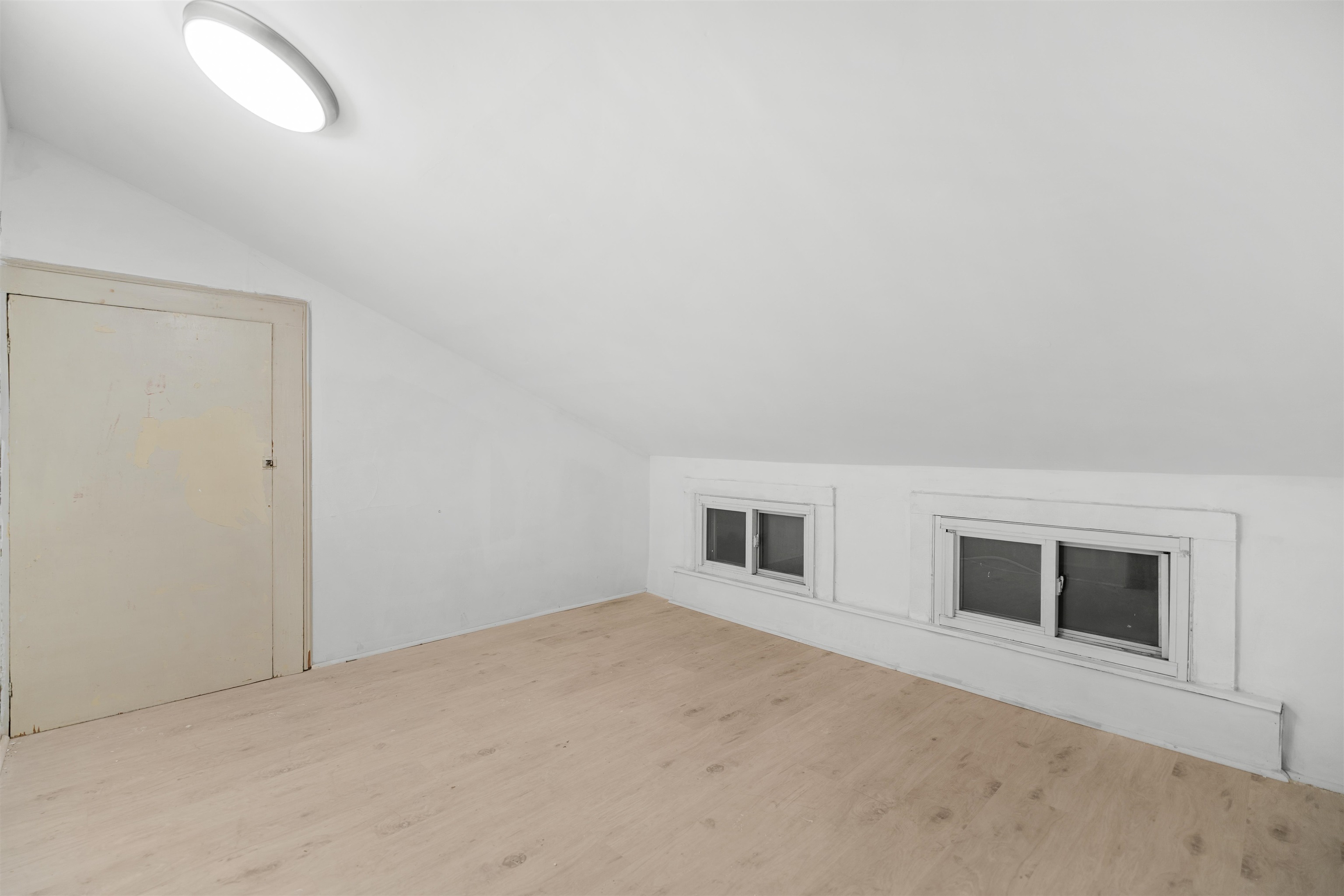 616 Chestnut Street, Unit 2 Kearny, NJ 07032 - Photo 11 of 21 a view of a livingroom with an empty space and a window
