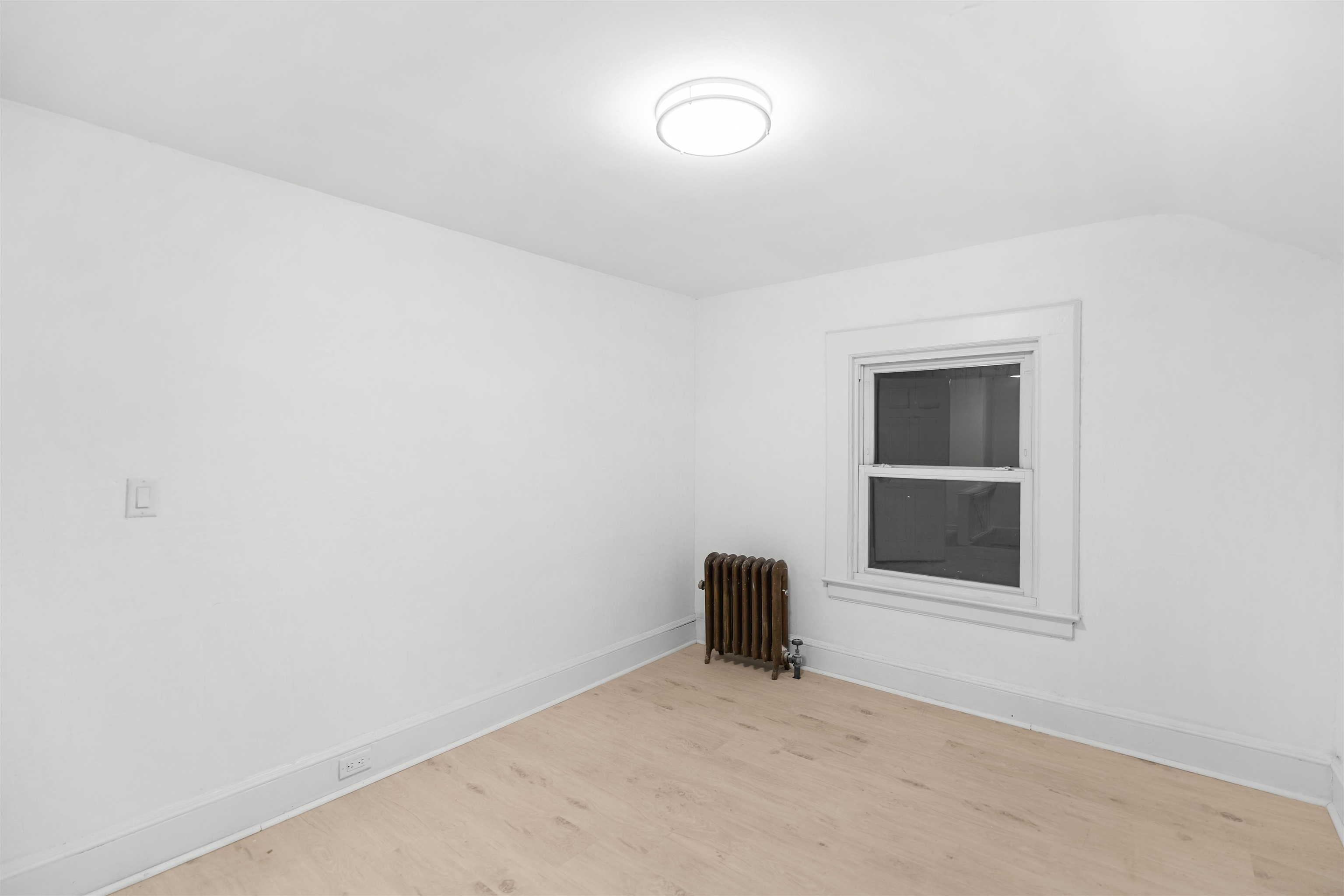 616 Chestnut Street, Unit 2 Kearny, NJ 07032 - Photo 14 of 21 a view of an empty room with a window