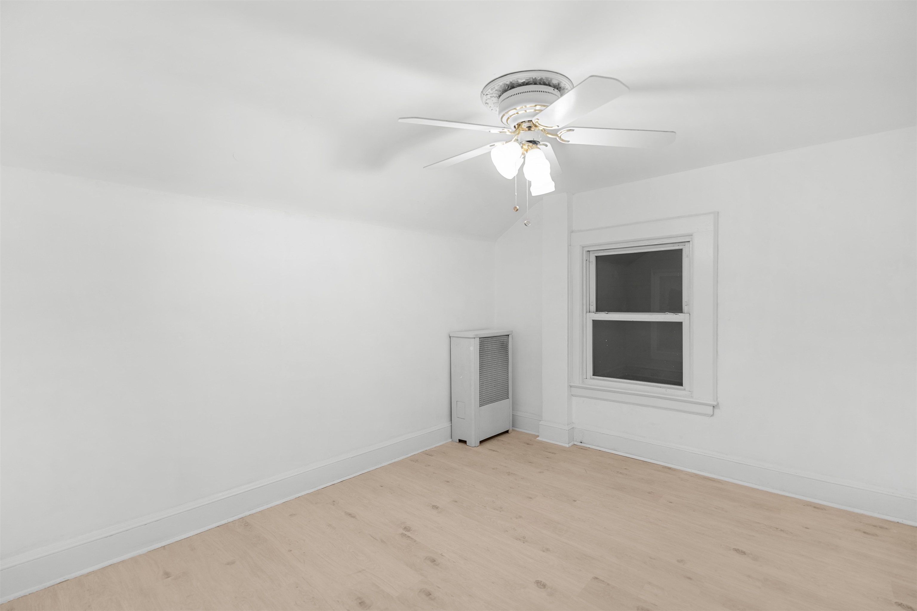 616 Chestnut Street, Unit 2 Kearny, NJ 07032 - Photo 15 of 21 an empty room with a empty space and a ceiling fan