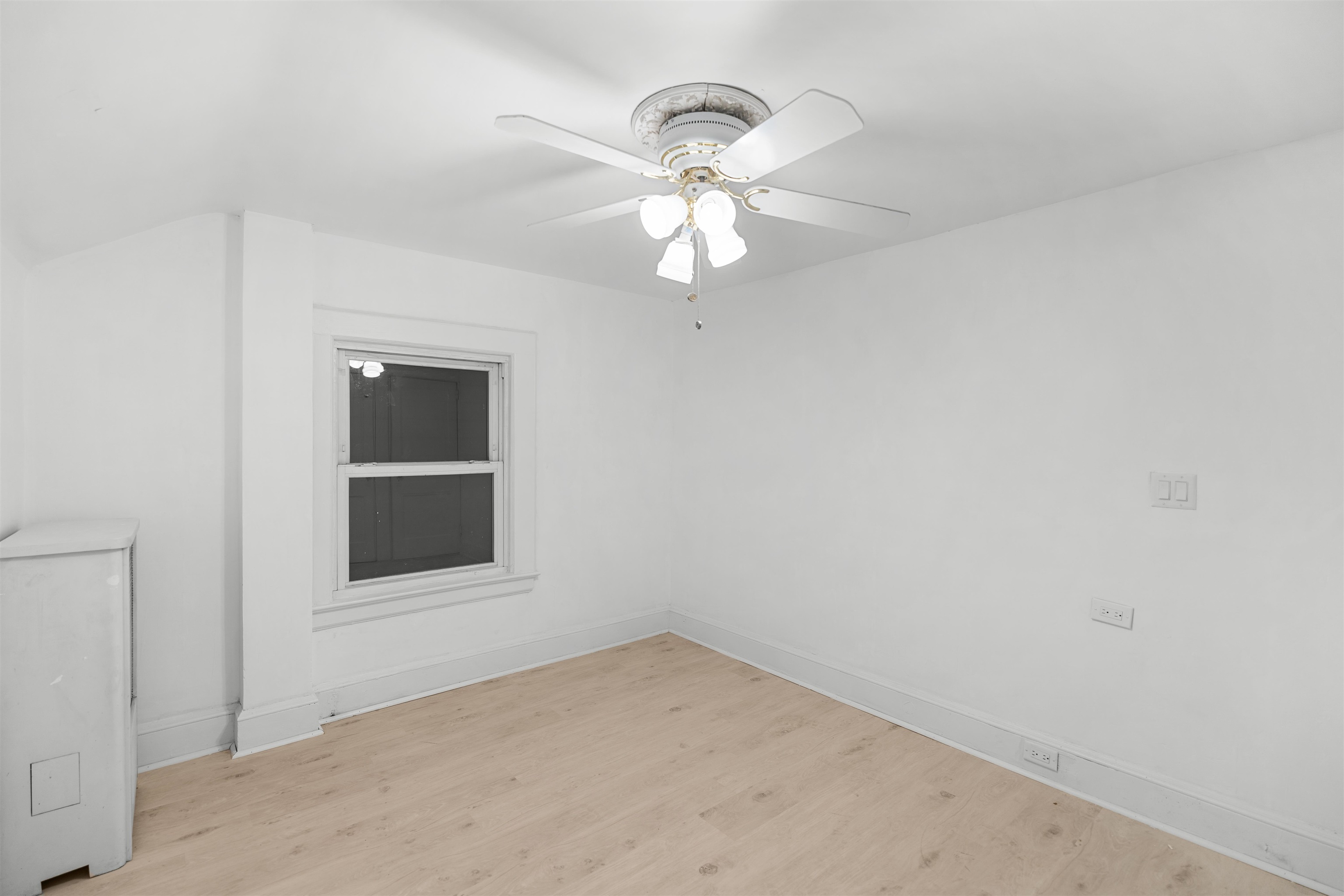 616 Chestnut Street, Unit 2 Kearny, NJ 07032 - Photo 16 of 21 en empty room with a fan and a window