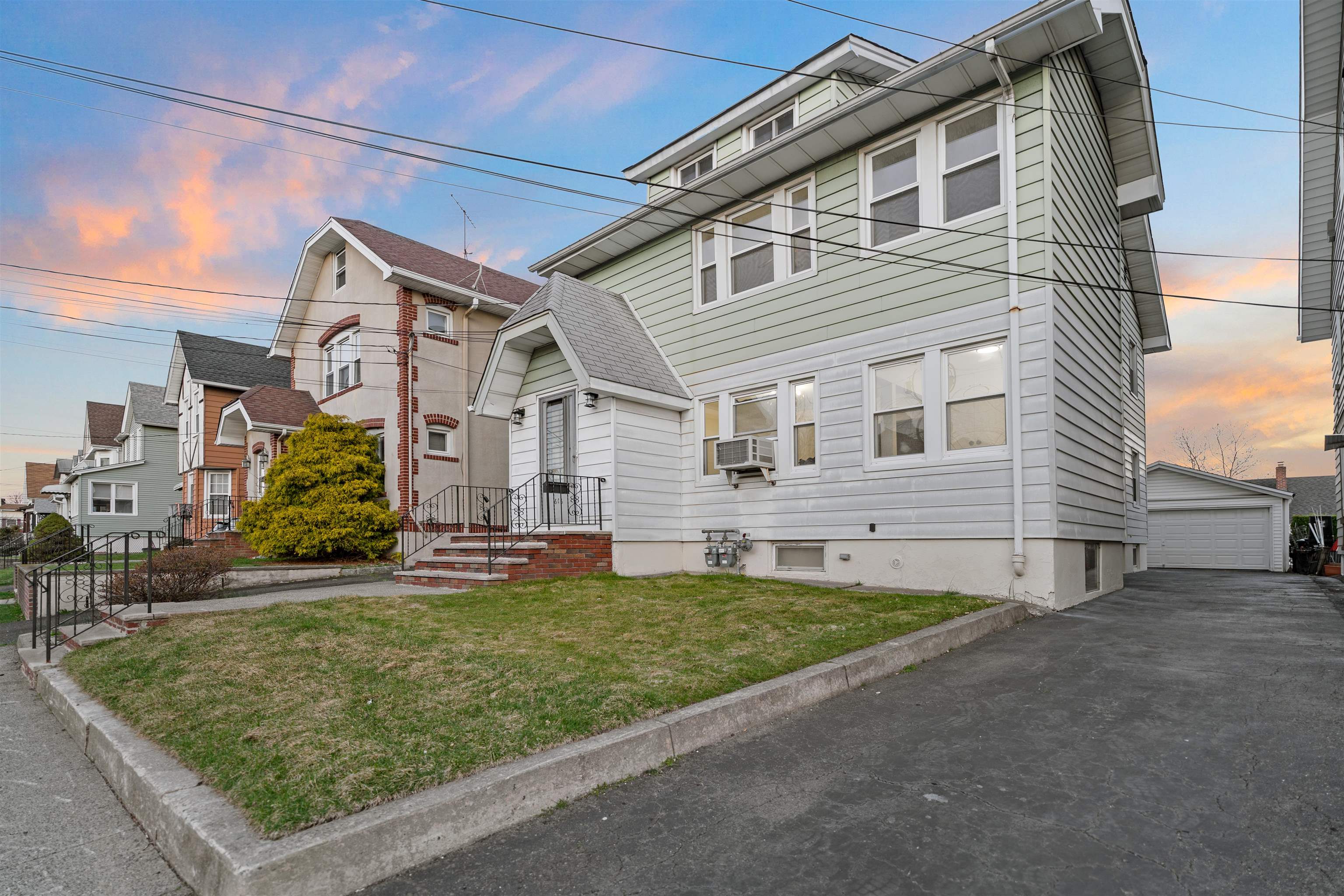 616 Chestnut Street, Unit 2 Kearny, NJ 07032 - Photo 20 of 21 a view of a house with a yard