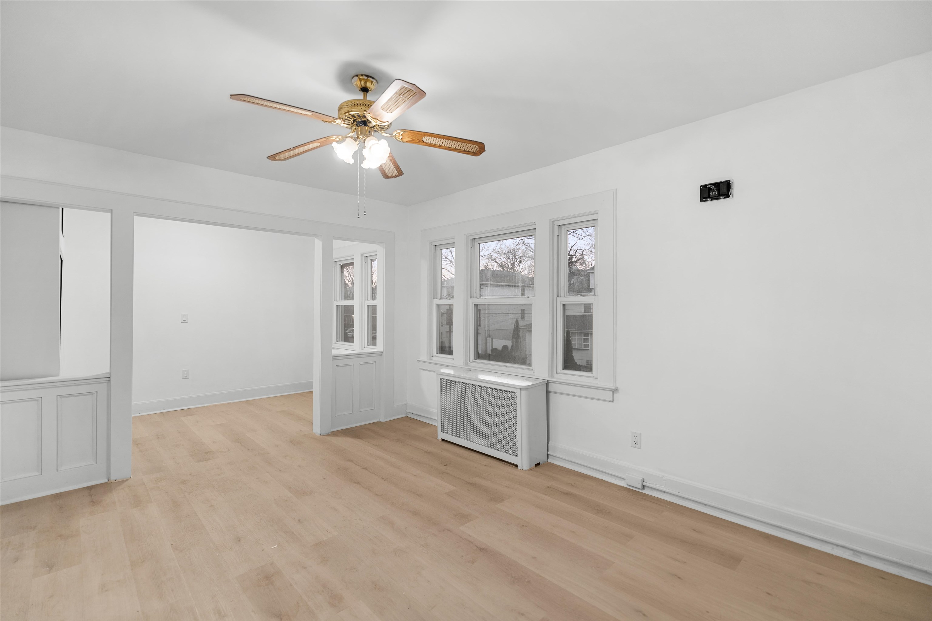 616 Chestnut Street, Unit 2 Kearny, NJ 07032 - Photo 2 of 21 wooden floor in an empty room with a window