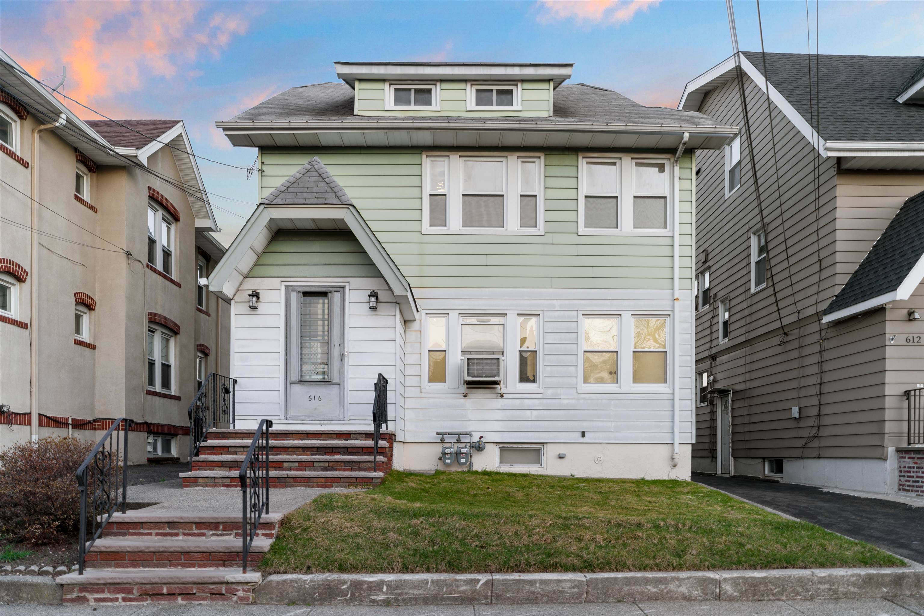 616 Chestnut Street, Unit 2 Kearny, NJ 07032 - Photo 21 of 21 a front view of a house with a yard