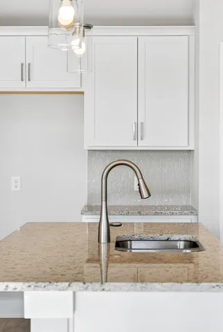 a stove top oven sitting inside of a kitchen