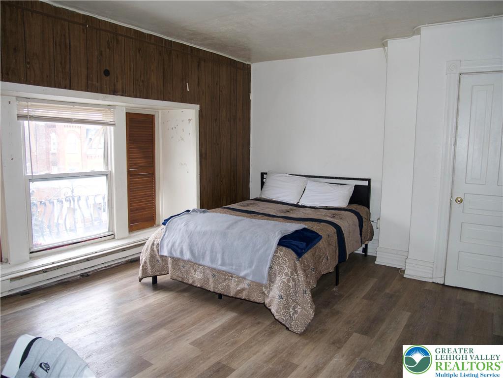 518 Tilghman Street, Unit 3 Allentown, PA 18102 - Photo 10 of 14 a bedroom with a bed and a window