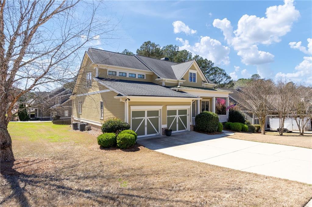 237 Highcrest Drive Acworth, GA 30101 - Photo 13 of 57 a front view of a house with a yard and garage