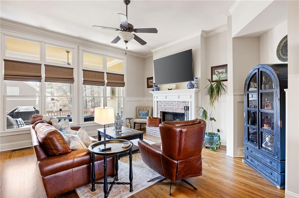 237 Highcrest Drive Acworth, GA 30101 - Photo 20 of 57 a living room with furniture a fireplace and a flat screen tv
