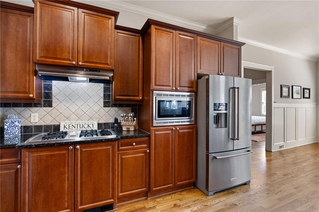 237 Highcrest Drive Acworth, GA 30101 - Photo 27 of 57 a kitchen with stainless steel appliances granite countertop a refrigerator stove and cabinets