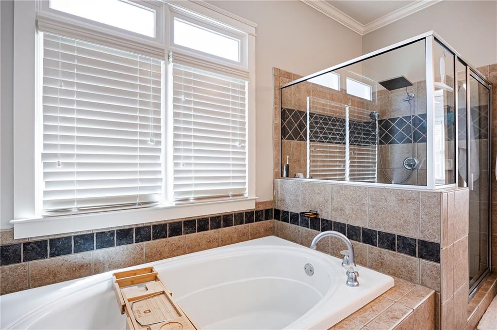 237 Highcrest Drive Acworth, GA 30101 - Photo 29 of 57 a bathroom with a tub and a sink