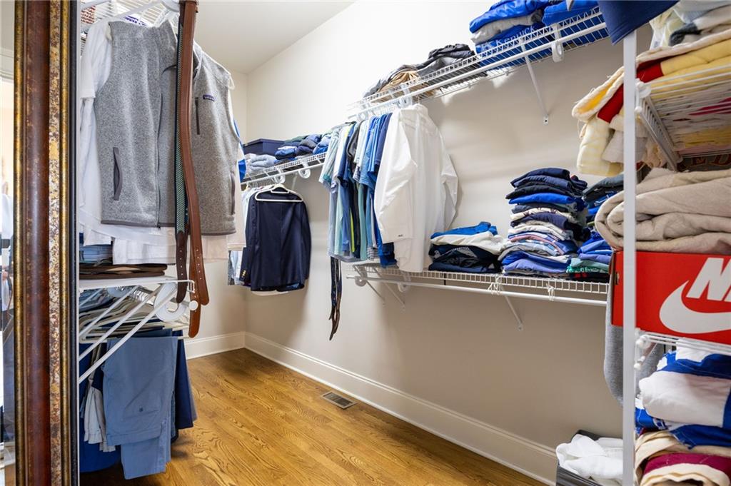 237 Highcrest Drive Acworth, GA 30101 - Photo 31 of 57 a view of walk in closet with clothes and shoes