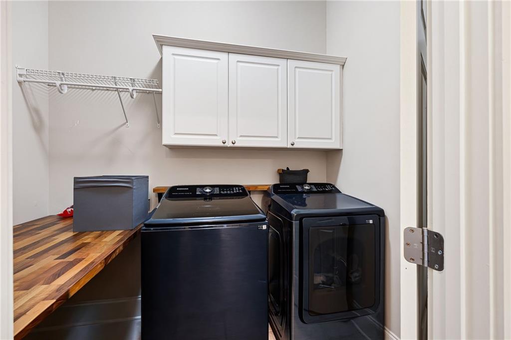 237 Highcrest Drive Acworth, GA 30101 - Photo 38 of 57 a kitchen with stainless steel appliances granite countertop a refrigerator and a stove