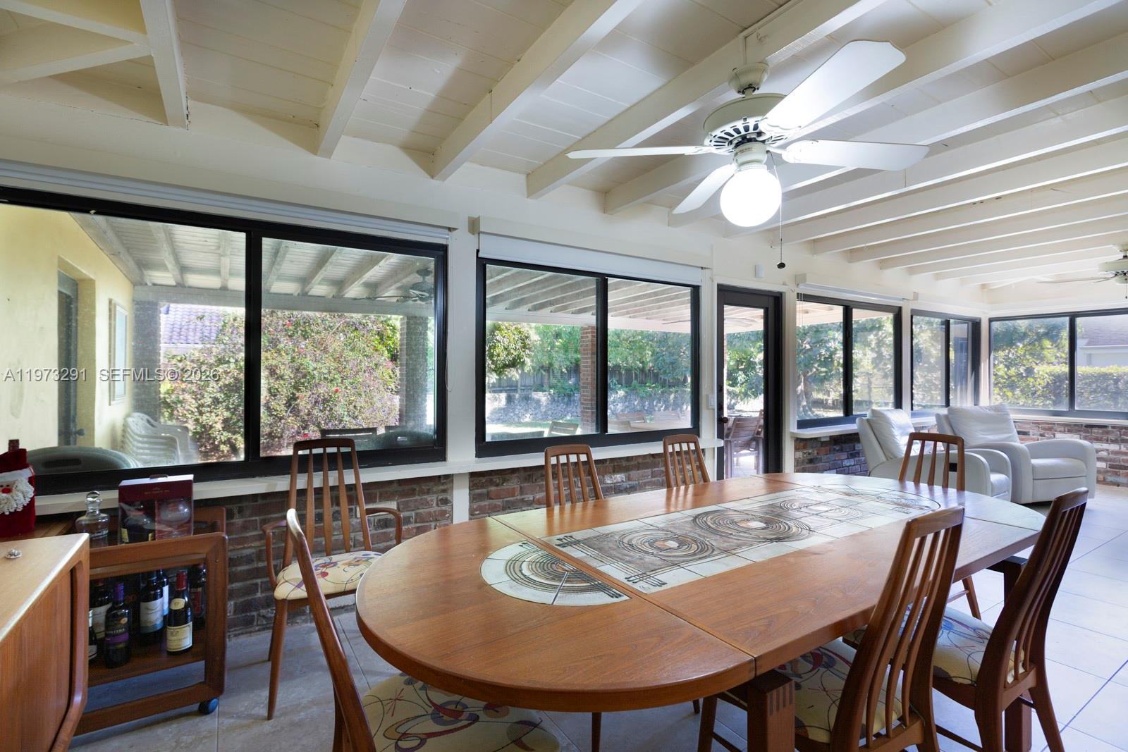 3721 Southwest 58th Avenue Miami, FL 33155 - Photo 12 of 23 a view of a dining room with furniture window and outside view